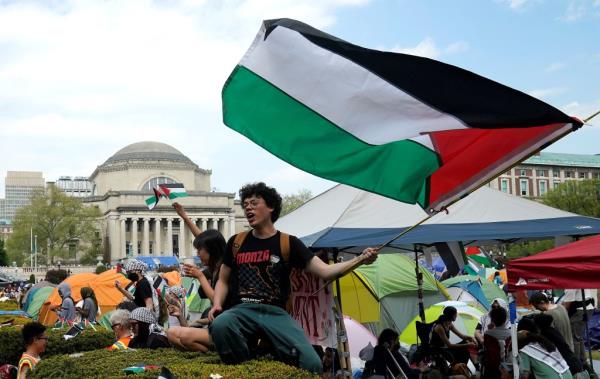 Protestors wave Palestinian flags on the West Lawn of Columbia University on April 29, 2024 in New York.