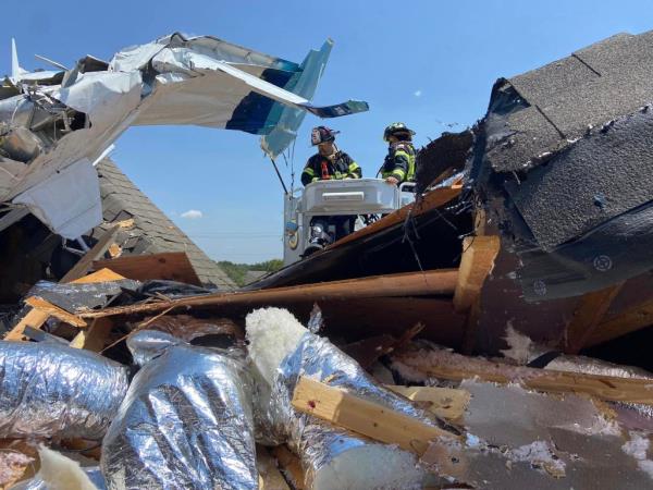 The three people aboard the plane were taken to a hospital with injuries.