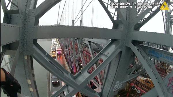 Members from the department's Emergency Service Unit climbed up the bridge at 5:23 p.m. wher<em></em>e they spotted the man and successfully brung him down.