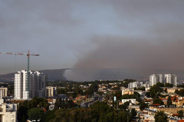 Smoke rises above Israel's border with Lebanon, as seen from Nahariya in northern Israel, October 22, 2023.