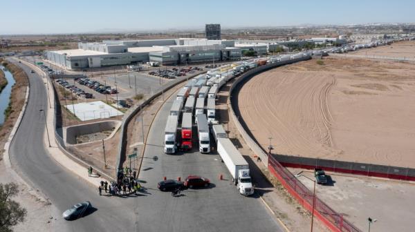 A long line of trucks is seen stalled at the Zaragoza Internatio<em></em>nal Bridge, one of two ports of entry in Ciudad Juarez going into the U.S.on April 12, 2022.