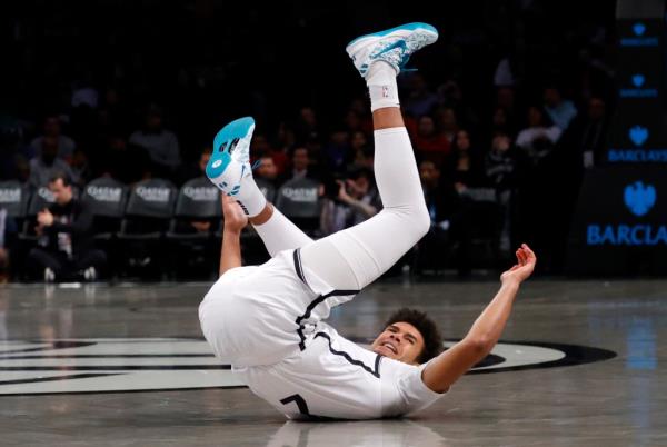 Lowry during the Nets' 112-107 win over the 76ers. Johnson sprained his right ankle and was forced to exit the game soon after the play.