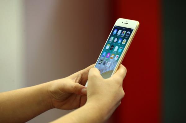 Person holding a newly launched iPhone 8 at a Vodafone store in Ankara, Turkey