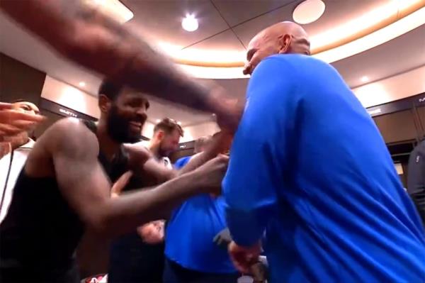 Jason Kidd meets with the Mavericks in the locker room following their Game 2 victory Friday.