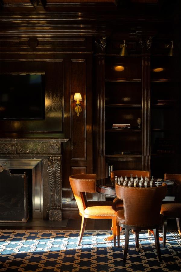 Features also include handsome wood-paneled walls.