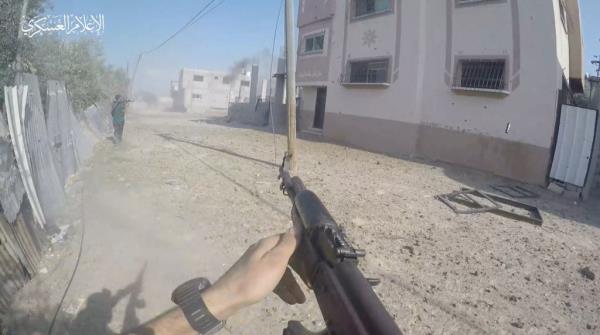 Hamas fighter holding a gun. 