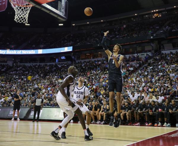 Victor Wembanyama #1 of the San Anto<em></em>nio Spurs shoots a floater over Ibou Badji #41 and Michael Devoe #54 of the Portland Trail Blazers in the second half of a 2023 NBA Summer League game at the Thomas & Mack Center on July 09, 2023 in Las Vegas, Nevada. 
