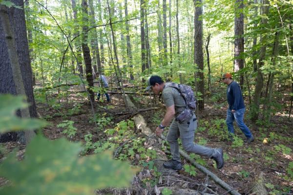 Volunteers search woodland near Moreau Lake State Park on Monday, October 2nd, 2023.