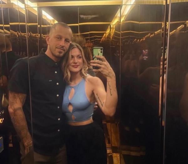 Frances Cobain and Riley Hawk in an elevator