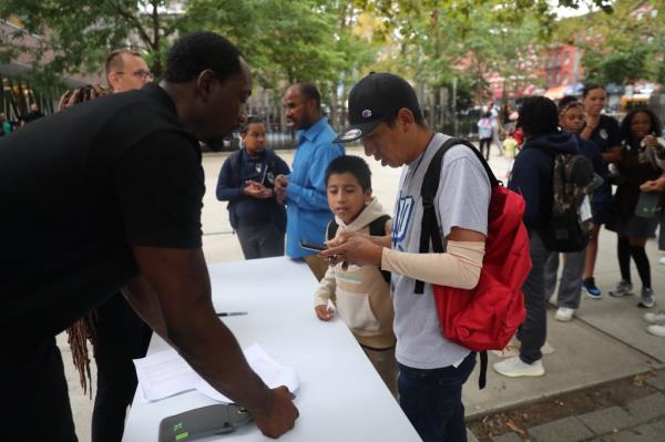 Asylum seekers waited to enroll their children into school in East Harlem