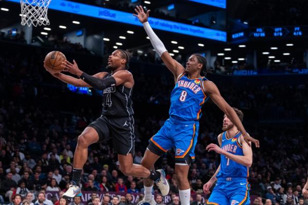 Dennis Smith Jr. #4 of the Brooklyn Nets goes up for a shot as Jalen Williams #8 of the Oklahoma City Thunder is too late