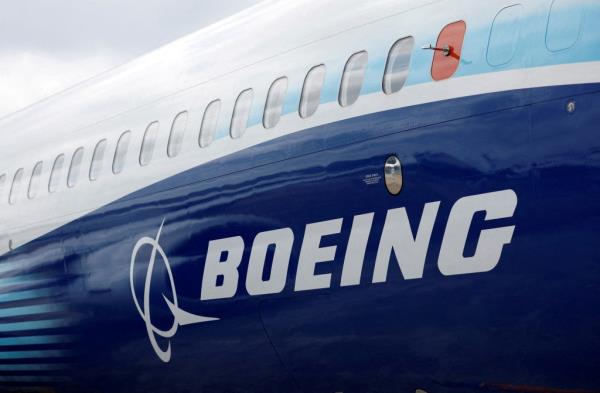 The Boeing logo is seen on the side of a Boeing 737 MAX at the Farnborough Internatio<em></em>nal Airshow, in Farnborough, Britain, July 20, 2022.