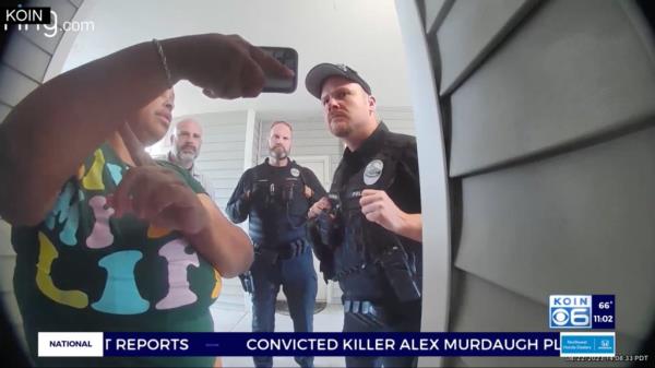 Police officers respond to the women's apartment
