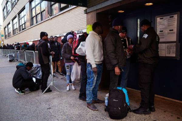 Migrants enter the former St. Brigid School on Wednesday, March 13, 2024 in New York, N.Y.