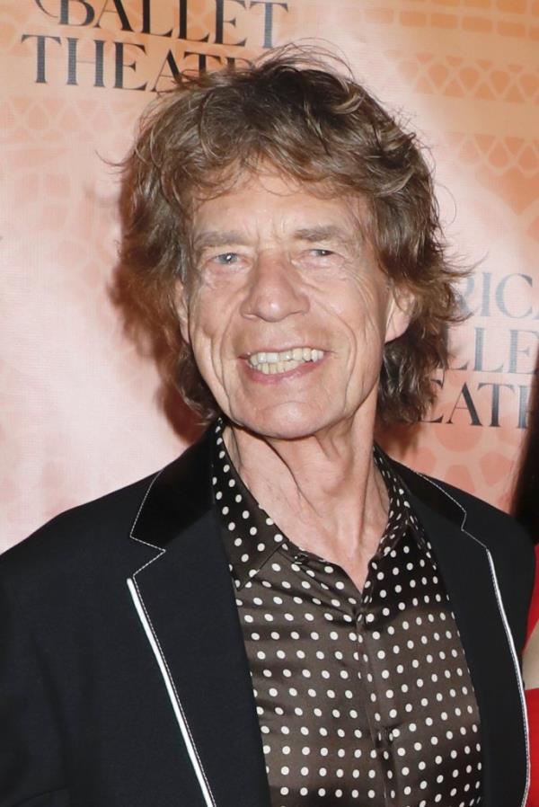 Mick Jagger smiling. 