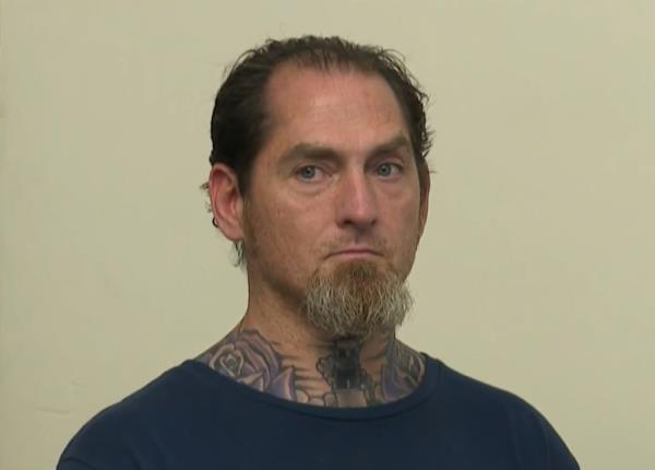 Police said Lawrence Hawkins broke windows at eight different sites and damaging 20 tombstones.