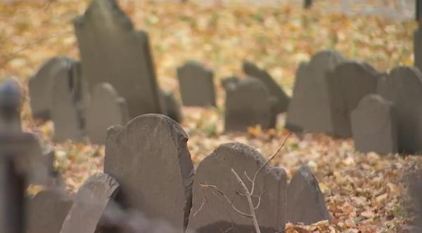 A Paul Revere tombstone is seen damaged at the Boston's Holocaust Memorial.