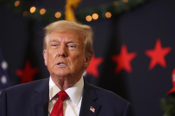 Republican presidential candidate and former U.S. President Do<em></em>nald Trump looks on during a campaign event on December 19, 2023 in Waterloo, Iowa.