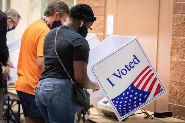 Voters cast their ballots in the voting booths at the early vote location at the Charleston Coliseum and Co<em></em>nvention Center in North Charleston, South Carolina on October 16, 2020.