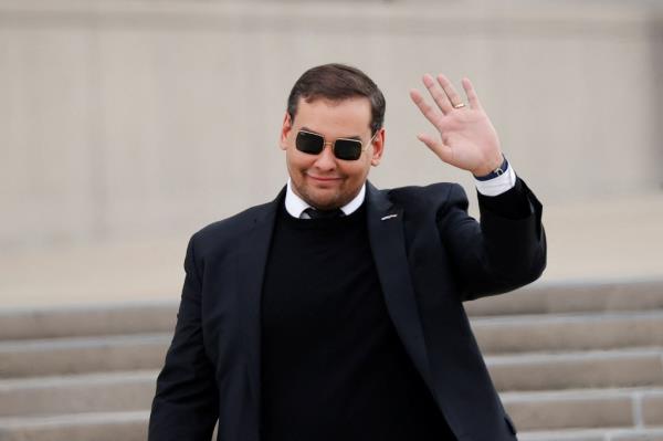 U.S. Representative George Santos (R-NY) gestures, as he walks outside the Central Islip Federal Courthouse on the day of his hearing, in Central Islip, New York, U.S., October 27, 2023.