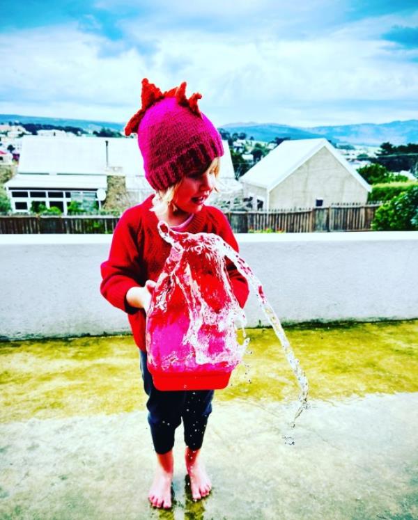 Ava with a watering can 