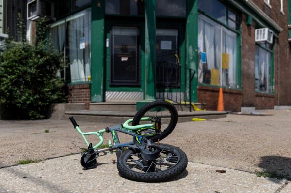 A child's bike left at the scene of a shooting  in Philadelphia,  on Tuesday, July 4, 2023. 