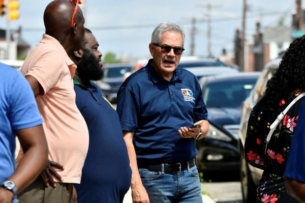 District Attorney Larry Krasner listens to community members as investigations are o<em></em>ngoing the day after a mass shooting in the Kingsessing section of southwest Philadelphia, Pennsylvania, U.S. July 4, 2023. 
