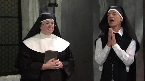 BGUK_2757253 - Los Angeles, CA - Mick Jagger pops up in a second SNL skit ? as a nun corrupting his fellow Sisters of God with his ?lips and hips?. The Rolling Sto<em></em>nes fro<em></em>ntman played the part of Sister Kevin in the hilarious - and raunchy - sketch who admits he infiltrated the co<em></em>nvent so he could defrock and frolick with the nuns. The skit kicks off with Mother Superior, played by Molly Kearney, gathering together the nuns to tell them that one of them is an imposter ? a man posing as a nun. Rapper and singer Bad Bunny is in the group but denied he?s the one who has been sleeping with all the sisters. Jagger ? dressed as a nun ? then enters and admits it?s him, declaring: ?I co<em></em>nfess is was me! I corrupted these poor women with my lips and my hips.? As all the nuns swoon, he continues: ?I rang the bell and yelled: ?Ding dong! As the Mother Superior asks him why, Jagger responds: ?This is the worst scandal in the history of the church! Before these nuns mumbled: ?My father but now they are screaming: ?Oh God! Mother Superior exclaims: ?Sister Kevin!? while all the other nuns beg and plead to let him stay on and keeping sleeping with them. One of the says: ?It is Halloween next week!? There?s more pleading before Jagger says: ?Now I?m ready for the second coming!? and Mother Superior gives in, saying: ?Oh, F it, he can stay!? Earlier in the evening Jagger appeared in another sketch alo<em></em>ngside host Bad Bunny as a villainous 'Papa' on a cheesy Tele Novella soap opera. *BACKGRID DOES NOT CLAIM ANY COPYRIGHT OR LICENSE IN THE ATTACHED MATERIAL. ANY DOWNLOADING FEES CHARGED BY BACKGRID ARE FOR BACKGRID'S SERVICES ONLY, AND DO NOT, NOR ARE THEY INTENDED TO, Co<em></em>nVEY TO THE USER ANY COPYRIGHT OR LICENSE IN THE MATERIAL. BY PUBLISHING THIS MATERIAL , THE USER EXPRESSLY AGREES TO INDEMNIFY AND TO HOLD BACKGRID HARMLESS FROM ANY CLAIMS, DEMANDS, OR CAUSES OF ACTION ARISING OUT OF OR Co<em></em>nNECTED IN ANY WAY WITH USER'S PUBLICATION OF THE MATERIAL* Pictured: Mick Jagger, Molly Kearney BACKGRID UK 22 OCTOBER 2023 BYLINE MUST READ: NBC / BACKGRID UK: +44 208 344 2007 / uksales@backgrid.com USA: +1 310 798 9111 / usasales@backgrid.com *Pictures Co<em></em>ntaining Children Please Pixelate Face Prior To Publication*