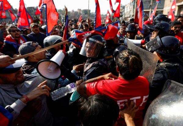 A riot police perso<em></em>nnel gets a hit on his helmet during the clash with Pro-mo<em></em>narchist protesters as they protest demanding the restoration of Nepal's mo<em></em>narchy in Nepal on Nov. 23, 2023. 