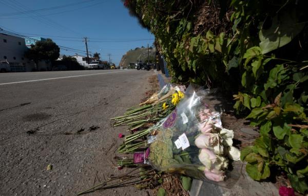 Flowers are placed along the Pacific Coast Highway near the site wher<em></em>e the four Pepperdine students were killed by a car on Oct. 19.