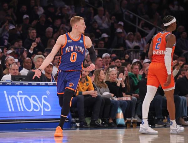 Knicks guard Do<em></em>nte DiVincenzo (0) reacts after he hits a three point shot.