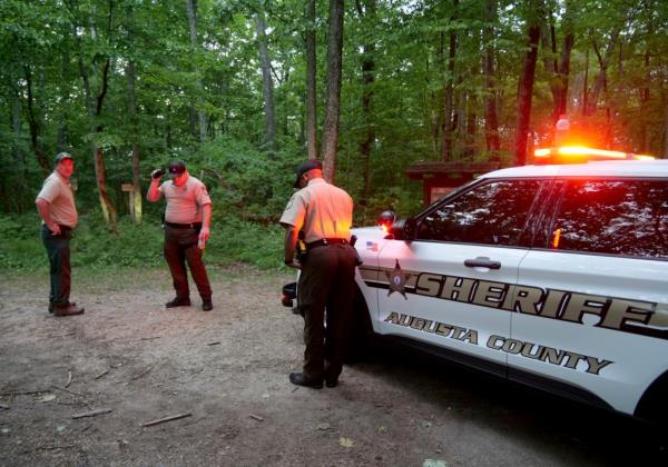 Authorities secure the entrance to Mine Bank Trail.