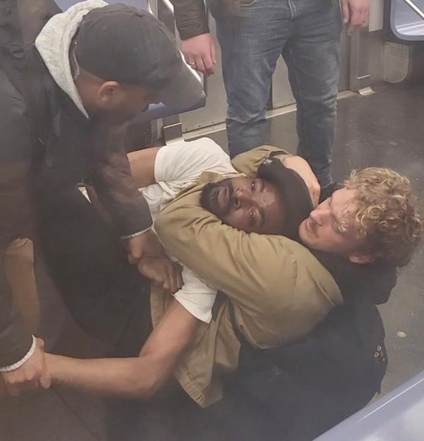 Daniel Penny placing Jordan Neely in a chokehold