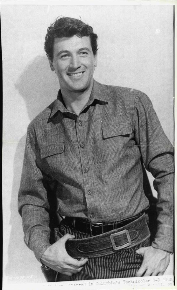 Rock Hudson smiling with his hands in his pockets, in Gun Fury 1949, photo taken on October 02, 1985
