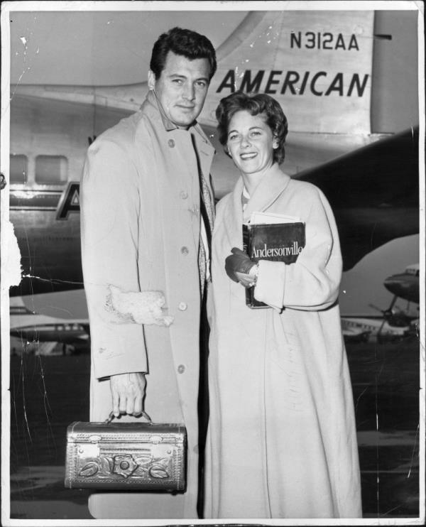 Actor Rock Hudson and Phyllis Gates posing together at Idlewild airport before their departure