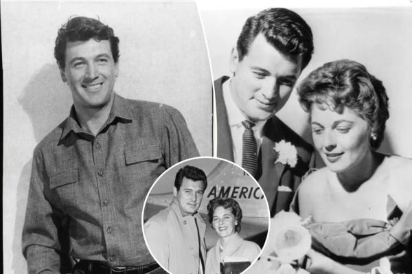 Actor Rock Hudson and his bride Phyllis Gates smiling next to their wedding cake after their marriage ceremony in 1955