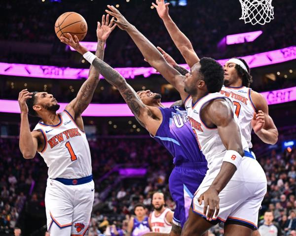 John Collins #20 of the Utah Jazz drives to the basket during the game against the New York Knicks on November 23, 2024 at Delta Center in Salt Lake City, Utah. 