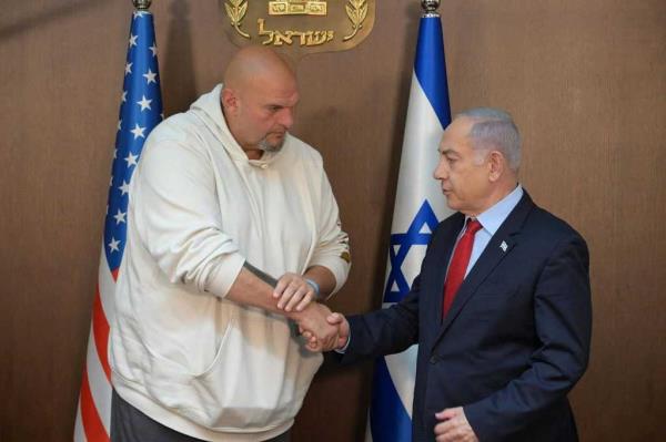 Israeli Prime Minister Benjamin Netanyahu shaking hands with Senator John Fetterman at the Prime Minister's Residence in Jerusalem on June 26, 2024.