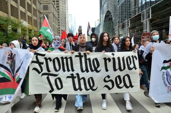 Group of Palestinian protesters marching through the streets of Chicago from Israeli co<em></em>nsulate during a demo<em></em>nstration organized by Chicago Coalition for Justice.