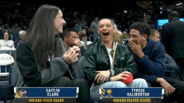 Tyrese Haliburton and his girlfriend chat with Fever star Caitlin Clark.  