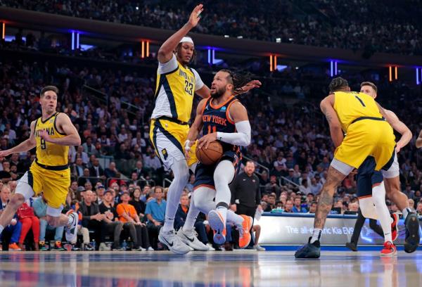 Knicks guard Jalen Brunson #11 drives pass Indiana Pacers center Myles Turner #33 during the first quarter.