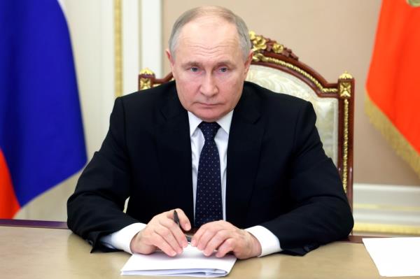 Russian President Vladimir Putin attends a meeting with Volgograd Region Governor Andrei Bocharov via video co<em></em>nference in the Kremlin in Moscow, Russia, Monday, April 15, 2024.