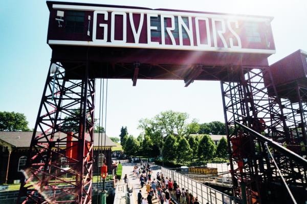 Governor's Island entrance with people walking through it.