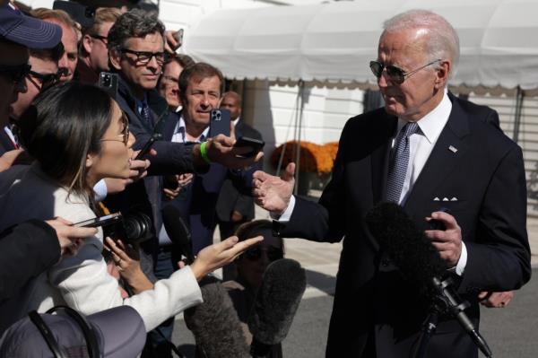 Joe Biden speaking to members of the press before boarding Marine One at the White House South Lawn.