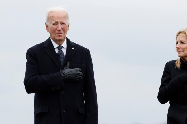 President Joe Biden places his hand on his heart alo<em></em>ngside first lady Jill Biden at the dignified transfer for fallen service members U.S. Army Sgt. William Rivers, Sgt. Breo<em></em>nna Moffett and Sgt. Kennedy Sanders at Dover Air Force ba<em></em>se on February 02, 2024 in Dover, Delaware.