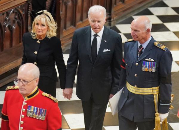 President Joe Biden, center, and first lady Jill Biden arrive for the funeral service of Queen Elizabeth II at Westminster Abbey in central London, Sept. 19, 2022. 