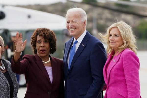 Rep. Maxine Waters (D-CA) waves next to U.S. President Joe Biden and first lady Jill Biden as the presidential couple arrives in Los Angeles, California, U.S. February 3, 2024.
