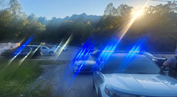 Law enforcement officers gather on the I-75 highway after reports of multiple people shot a<em></em>bout nine miles north of London, Kentucky, U.S. September 7, 2024.  
