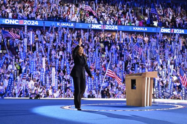 2024 Democratic presidential candidate Kamala Harris arriving on stage, waving to the crowd at the Democratic Natio<em></em>nal Co<em></em>nvention in Chicago, Illinois