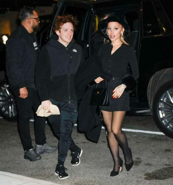 Ethan Slater smiling with Ariana Grande. 